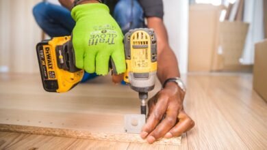 Close-up of a cordless drill at work showing how to sync garage door opener Genie remotes