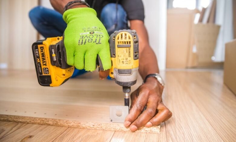 Close-up of a cordless drill at work showing how to sync garage door opener Genie remotes